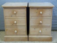 A pair of pine three drawer bedside cabinets,