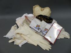 An embroidered hat and a quantity of further textiles,