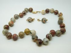 A lace agate beaded necklace and matching earrings