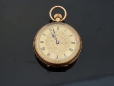 An 18k yellow metal cased ladies fob watch with engraved foliate decoration, marked to case 18k,