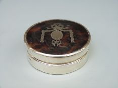 A George V hallmarked silver and tortoiseshell dressing table pot, London 1919 maker's mark rubbed,