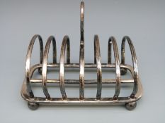 A George V hallmarked silver six slice toast rack Sheffield 1910 maker Cooper Brothers & Sons Ltd,