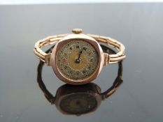 A 9ct gold ladies wristwatch with two-tone gold and silver face,