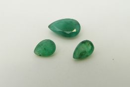 Three pear cut emeralds, the largest approximately 0.