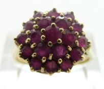 A 9ct gold ring set with rubies in a cluster, size P/Q, 4.