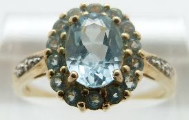 A 9ct gold ring set with aquamarines and diamonds, size P,