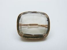 A Victorian brooch set with a large mixed cut quartz