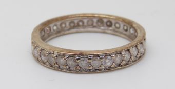A 9ct gold eternity ring set with diamonds (size N)