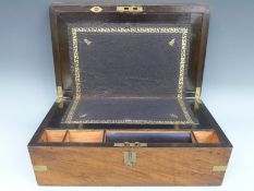 A 19thC inlaid and brass bound walnut writing slope with fitted interior,