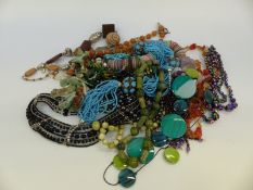 A collection of beaded necklaces to include agate, garnets,