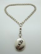 A Victorian silver locket with buckle decoration & original pierced accompanying chain necklace
