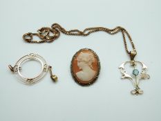 An Art Nouveau pendant set with central blue stone and seed pearl on 9ct gold chain,