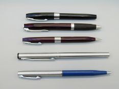 Five Sheaffer White Dot pens and pencils comprising stainless steel fountain pen,