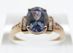 A 9ct gold ring set with a mystic topaz and diamonds, size O/P, 2.