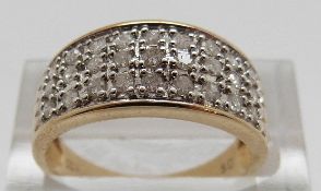 A 9ct gold ring set with diamonds in three rows, size O, 2.