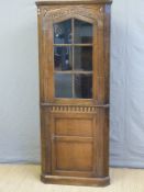 An Old Charm style glazed oak corner cupboard,