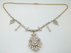 A Belle Epoque diamond set necklace / brooch in a foliate and floral design,