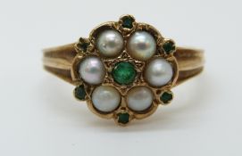 A 9ct gold ring set with pearls and emeralds, size P, 3.