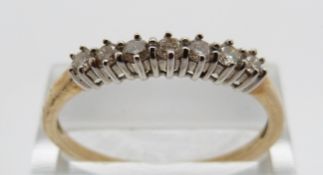 A 9ct gold half eternity ring, size V, 1.