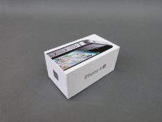 A boxed iPhone 4s,