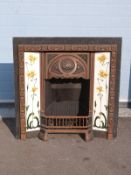 An Art Nouveau style cast iron fire surround