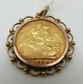A 1904 gold full sovereign in mount,