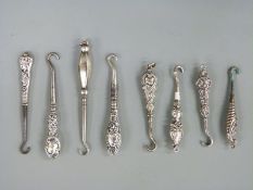 Eight various small hallmarked silver handled button hooks