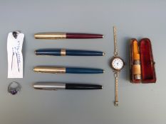 A 9ct gold cased ladies wristwatch, Parker Pens one with 14k gold nib another being a Parker 17,