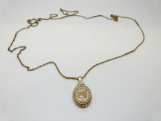 A locket set with gold nuggets