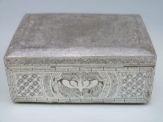 An Eastern white metal wirework box raised on four ball feet,