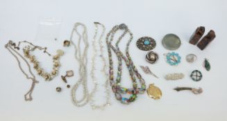 A collection of brooches to include Charles Horner example set with enamel, silver and ceramic,