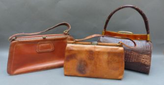 Three vintage leather, lizard and 1950's alligator handbags,