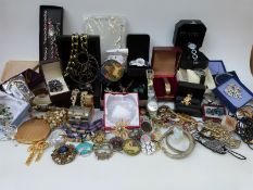 A large collection of costume jewellery including amethyst brooch, rock crystal pendant,
