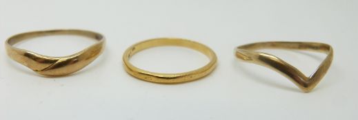 A 22ct gold wedding band (1.6g) and two 9ct gold rings (2.