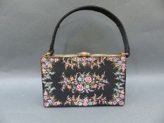 A 1950s 'Waldybag' evening bag with floral decoration, containing a matching Stratton compact,
