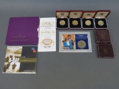 A collection of cased and packed Royal Mint and other coins to include £5,