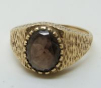 A 9ct gold ring set with a smoky quartz, 3.