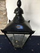 A cast iron Victorian/Victorian style street lamp base with associated lamp (detached),