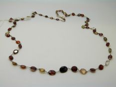 A 14ct gold necklace set with multicoloured garnets and quartz