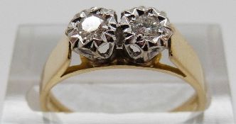 An 18ct gold ring set with two brilliant cut diamonds, size N, 3.