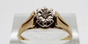 An 18ct gold ring set with a diamond in an illusion setting, size R,