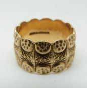 A 9ct gold ring with unusual textured design, 8.