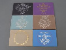 Six brilliant uncirculated Royal Mint coinage sets for Britain and Northern Ireland 1976 - 1981