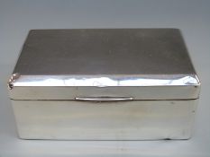 A hallmarked silver cigarette box,