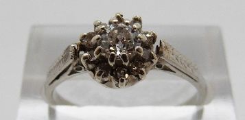 An 18ct white gold ring set with a round cut diamond measuring approximately 0.