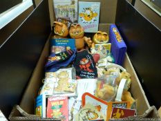 A quantity of Garfield collectables to include bendy Garfield, Russian doll, badges, slip ons, Pez,