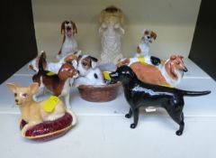 A collection of Beswick and Royal Doulton dog figures including Chihuahua,