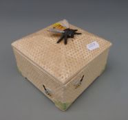 A Crown Devon honeycomb box with bee finial