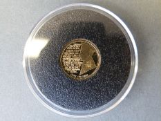 A 2014 1914/1918 commemorative miniature gold crown with Lawrence Binyon 'At the Going Down of the