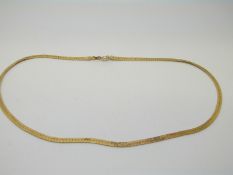 A 14k gold ribbon necklace, 7.
